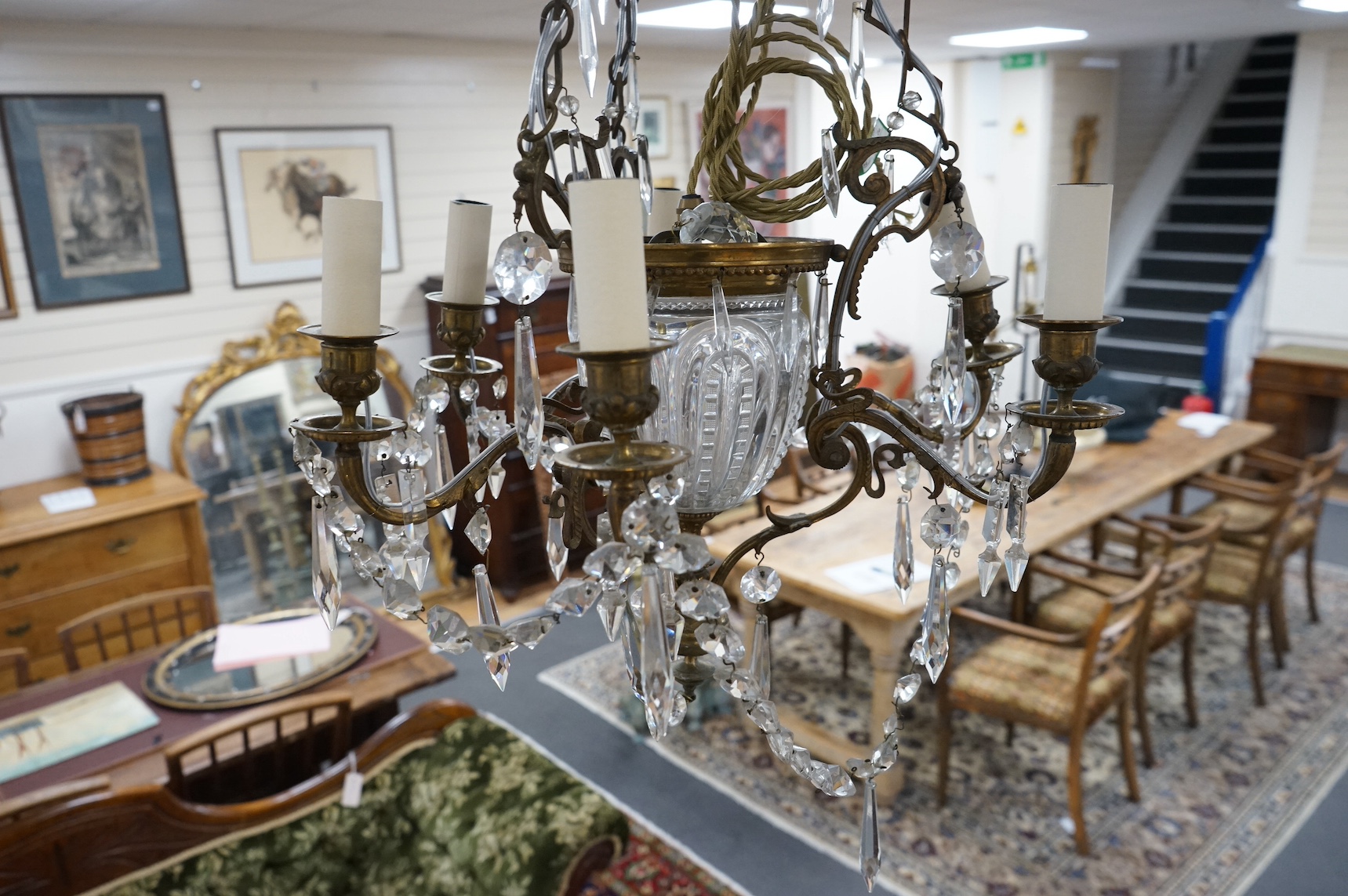 A glass and brass six branch chandelier, 65cm high. Condition - fair